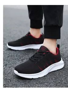 Detail view of breathable black and red mesh upper on trendy men's sport sneakers
