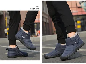 Close-up of waterproof navy snow boots with warm faux fur lining and velcro strap
