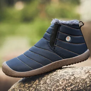 Waterproof navy blue winter boots for men featuring warm gray faux fur lining
