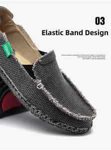 Details von dunkelgrauen Canvas-Loafers mit Gummizug und grünem Mode-Label