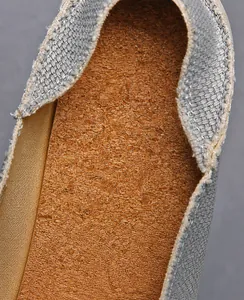 Macro shot of breathable cork insole and soft fabric lining on canvas loafer