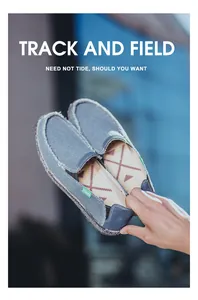 Detailed close-up of blue canvas loafer featuring durable fabric and fashion side label