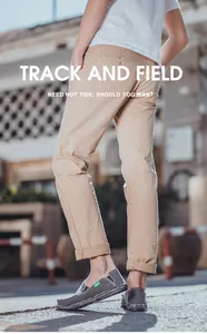 Urban street view of men in casual khaki trousers and grey canvas slip-on loafers