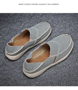 Detailed close-up of breathable canvas loafers with cork insole and raw seam edges