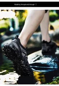 Detail of breathable hiking shoes with deep-tread rubber soles for outdoor wading