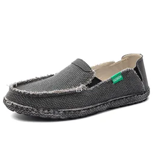 Men's casual loafers in dark gray woven canvas with textured rubber soles and fashion tag