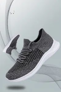 Close-up of lightweight grey breathable knitted running shoes with flexible white soles