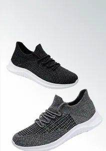 Detail view of breathable knitted mesh running shoes in black and dark grey colors