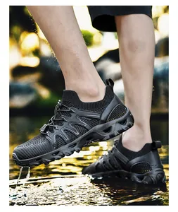 Close-up of anti-slip rubber sole and breathable mesh on outdoor wading shoes in nature
