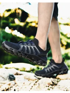 Detail of breathable navy mesh hiking shoe with drainage sole and quick-lace system