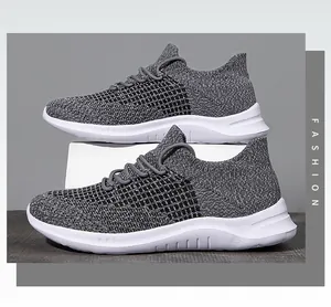 Close-up of lightweight grey breathable fly-knit men running shoes with white thick sole