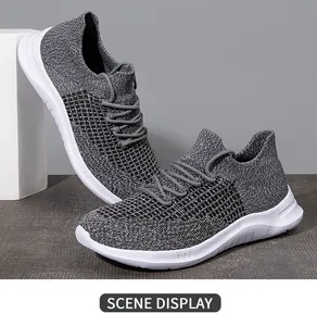 Detail showing grey breathable fly knit upper and thick white sole on men's running shoes