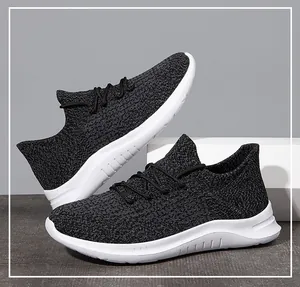 Detail of breathable fly-knit mesh texture and cushioned thick sole on men's running shoes