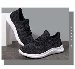 Detail of black breathable knit upper and thick white cushioned sole on men's sneakers