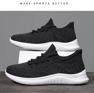 Detail of black breathable fly-knit upper and thick white cushioned sole on men sneaker