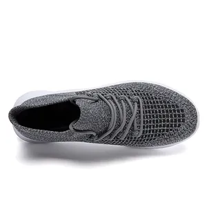 Top view of men's lightweight breathable knit running shoes in textured grey fabric