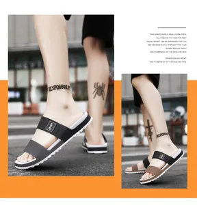 Detail view of sport slippers featuring thick anti-slip soles and dual strap design