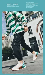 Outdoor street style view of trendy men's lightweight breathable running sneakers and polo shirt