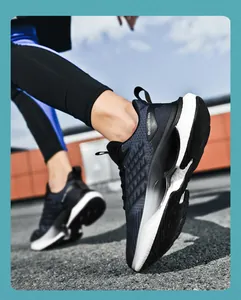 Detail of navy knit upper and cushioned white sole on running shoes worn by a model