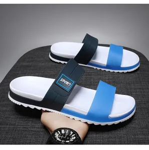Detail of blue and white EVA men's slippers featuring sport labels and anti-slip thick soles