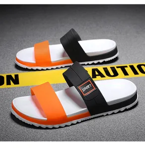 Detail of dual-strap men's sport slides with orange translucent and black SPORT bands