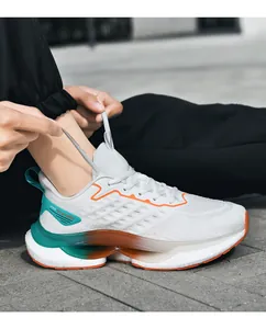 Detail of man tying laces on white mesh running shoes with orange and cyan accents