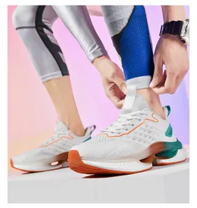 Detail of white mesh running shoes with orange TPU support and cushioned popcorn sole