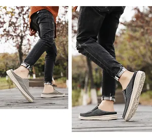 Detailed view of grey canvas mule sneakers with thick anti-slip rubber soles outdoors