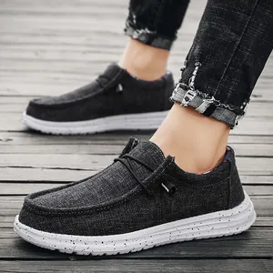 Men's casual slip-on canvas loafers in charcoal grey with paint-splatter thick white soles