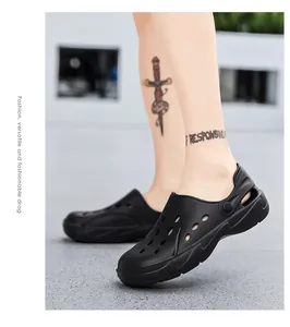 Close-up of black breathable clog shoes with thick non-slip soles on a male model