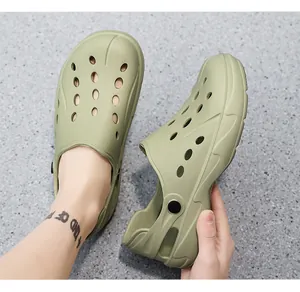 Detail of olive green clogs with breathable holes and adjustable heel strap