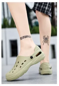 Side view of olive green lightweight EVA garden clogs with thick soles on feet