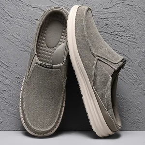Grey canvas mule loafers for men with rubber soles and breathable slip-on design