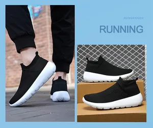 Detail of black knit slip-on sneakers with breathable mesh and white cushioned sole