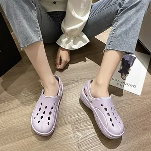 Detail view of light purple breathable EVA clogs with adjustable heel strap on wood floor