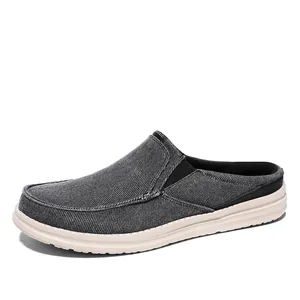 Men's dark grey canvas mules with thick white soles and elastic side panels