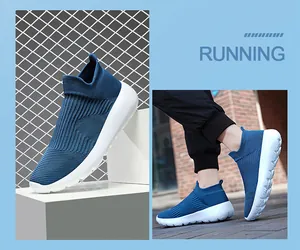 Detail view of blue knit running shoes with breathable mesh and flexible white soles