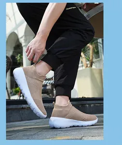 Close-up of khaki breathable knit mesh slip-on sneaker with thick white sole detail