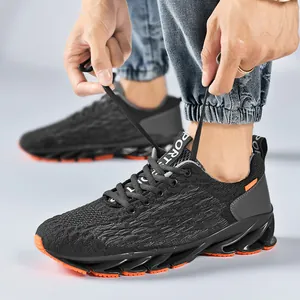 Men's black breathable knit running shoes with orange blade cushioning soles