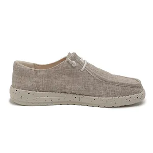 Detail view of khaki canvas men loafers with speckled foam sole and breathable texture