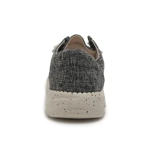 Detail of canvas loafers featuring textured woven fabric and speckled off-white thick sole
