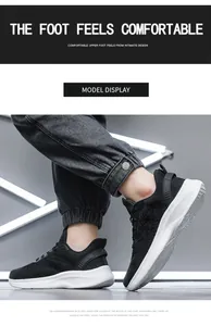 Detail van ademend mesh-bovenwerk en dikke gedempte zool op zwart-witte hardloopschoenen heren