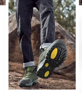 Rugged olive hiking boot detail with deep tread yellow anti-slip rubber sole