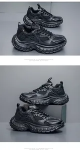 Detailed close-up of all-black chunky dad sneaker featuring mesh and leather panels