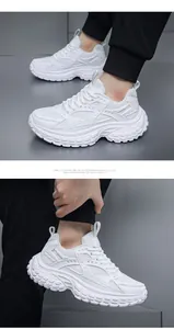 Close-up of white platform sneakers featuring breathable mesh and layered leather texture