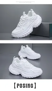Detailed macro view of white chunky sneakers featuring mesh panels and thick anti-slip soles