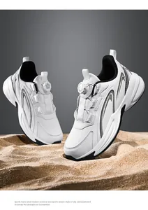 Detail of the modern white sneakers with star-shaped rotary lacing system on desert sand