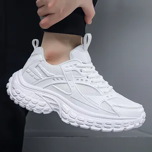 White chunky sneakers for men with breathable mesh panels and thick sculpted soles