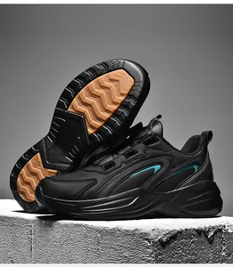 Detail of non-slip rubber outsole with deep wavy patterns on black athletic sneakers
