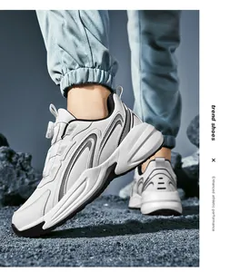 Macro shot of white sports sneakers with rotating buckle and thick soles on rocky ground